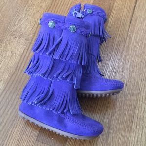 Bright-purple, suede, fringed, Minnetonka boots.